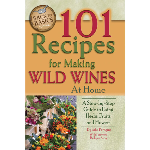 A book cover for "101 Recipes for Making Wild Wines at Home" on a counter.