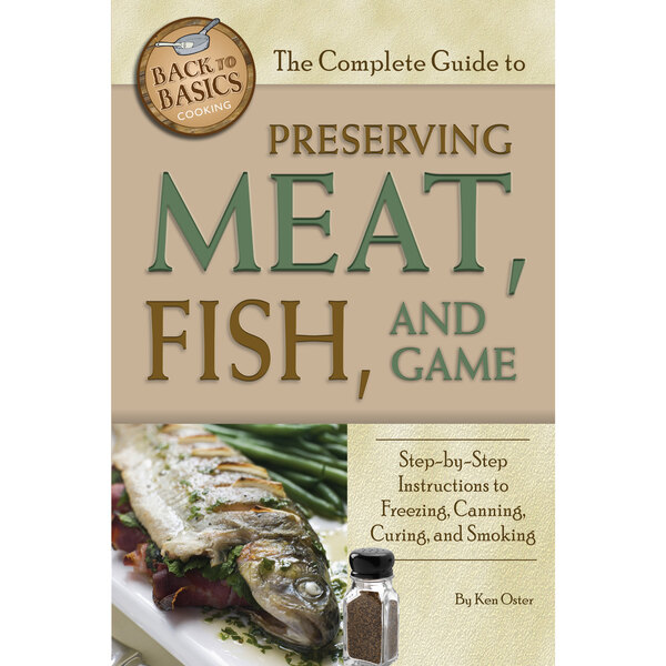 The Complete Guide to Preserving Meat, Fish and Game book cover on a counter.