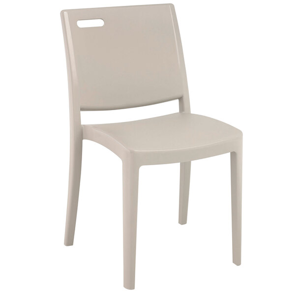 A white plastic Grosfillex Metro chair.