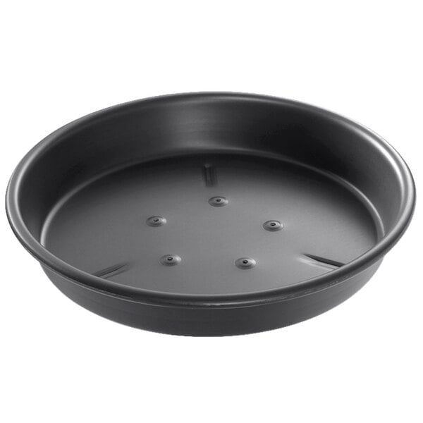 A black round Chicago Metallic BAKALON pizza pan with holes in it.