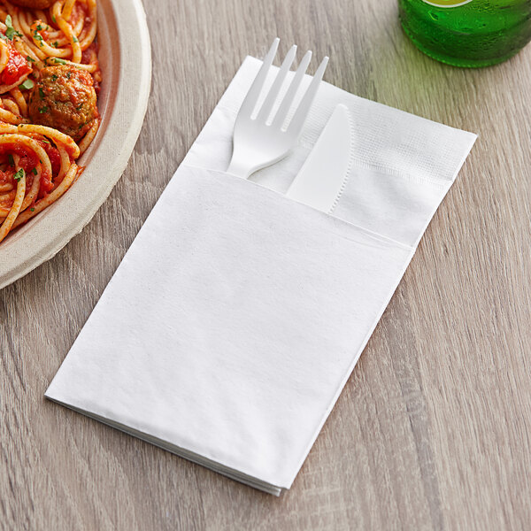 A fork and knife in a white Choice ReadyNap pocket fold.