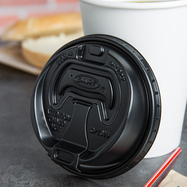 A white paper hot cup with a black Dart Optima lid and a straw.