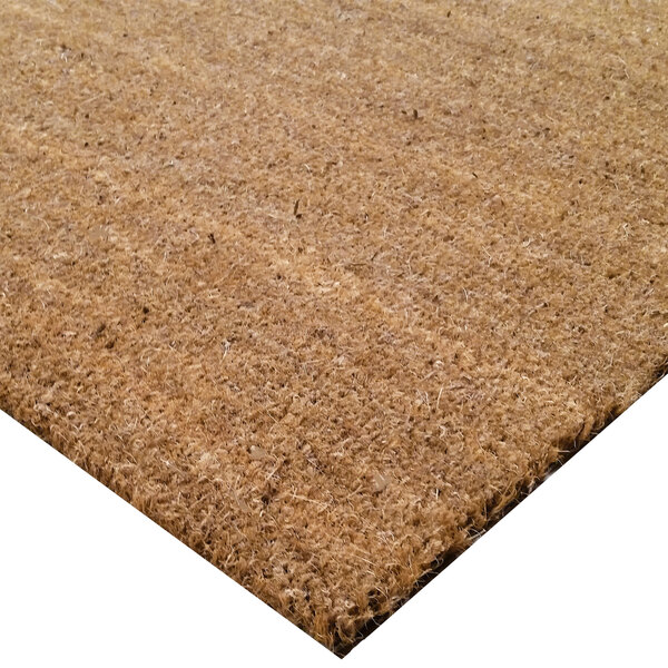A close up of a natural tan Cactus Mat scraper mat with a cocoa brush design.