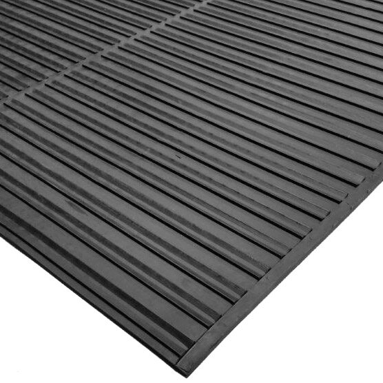 A close-up of a black rubber mat with a black stripe.
