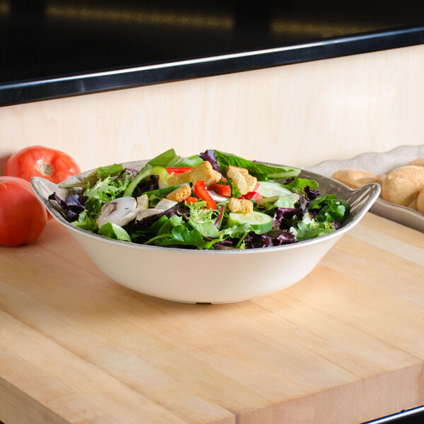A Thunder Group Jazz melamine bowl filled with salad on a table.