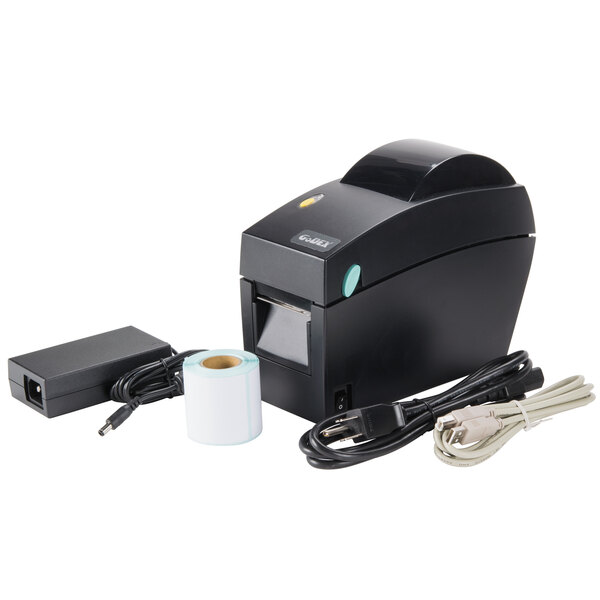 A black Tor Rey DT-2 thermal label printer on a counter with a roll of paper.