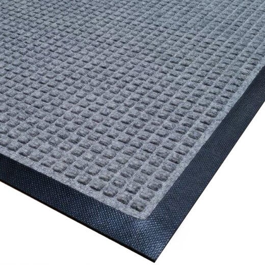 A close-up of a grey mat with black trim.