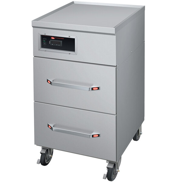 A stainless steel Hatco cabinet with two drawers on wheels.