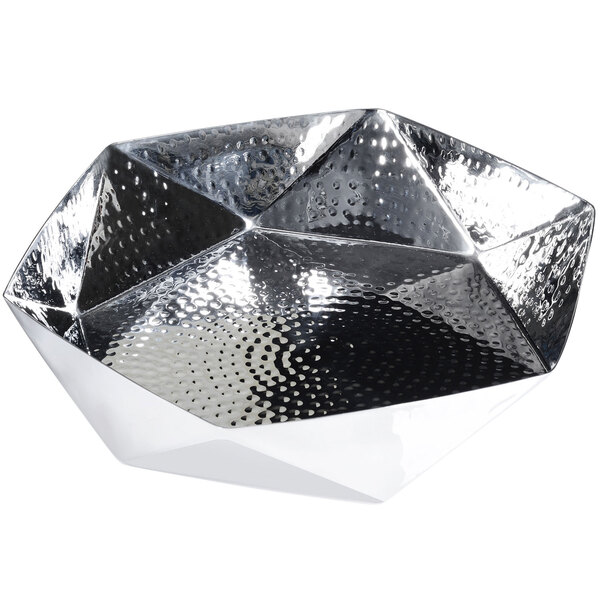 A silver metal bowl with a geometric design.
