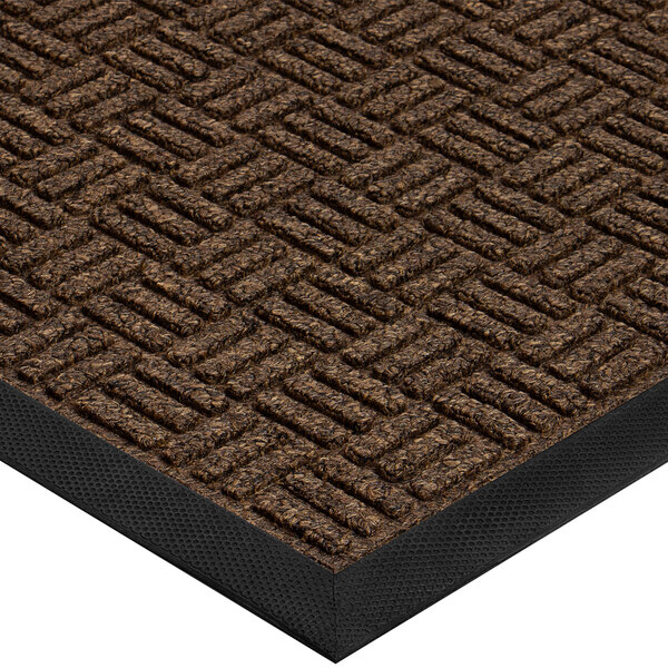 A brown Cactus Mat parquet carpet mat with black trim.
