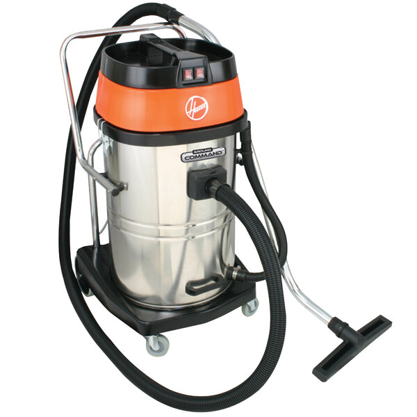 A Hoover Ground Command wet/dry vacuum on wheels with an orange handle.