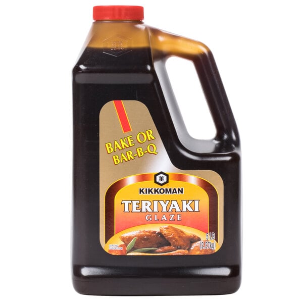 A black bottle of Kikkoman Teriyaki Glaze with a red label and lid.