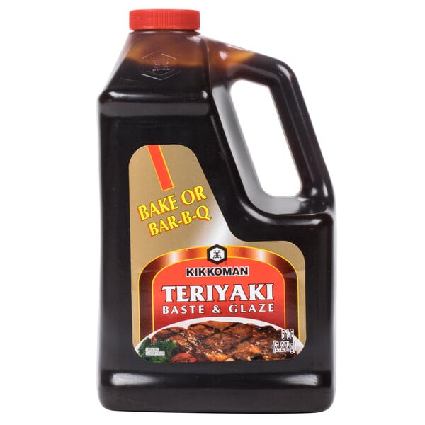 A black bottle of Kikkoman Teriyaki Baste & Glaze with a label.