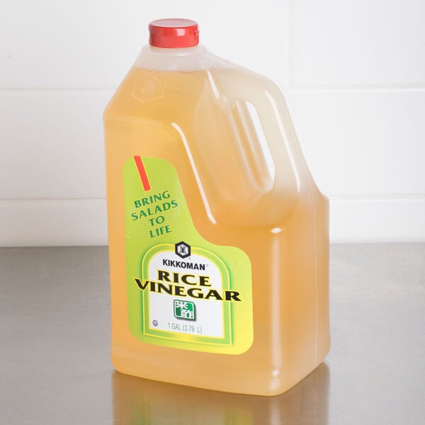 A plastic jug of Kikkoman 1 gallon rice vinegar.