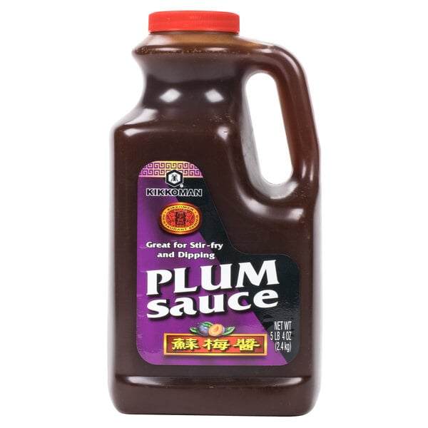 A case of four Kikkoman Plum Sauce jugs with labels.