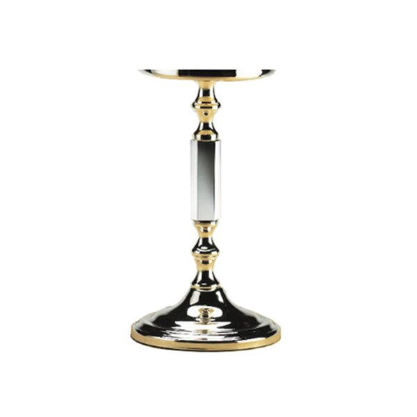 A silver and gold Sterno La Rue lamp base on a table.