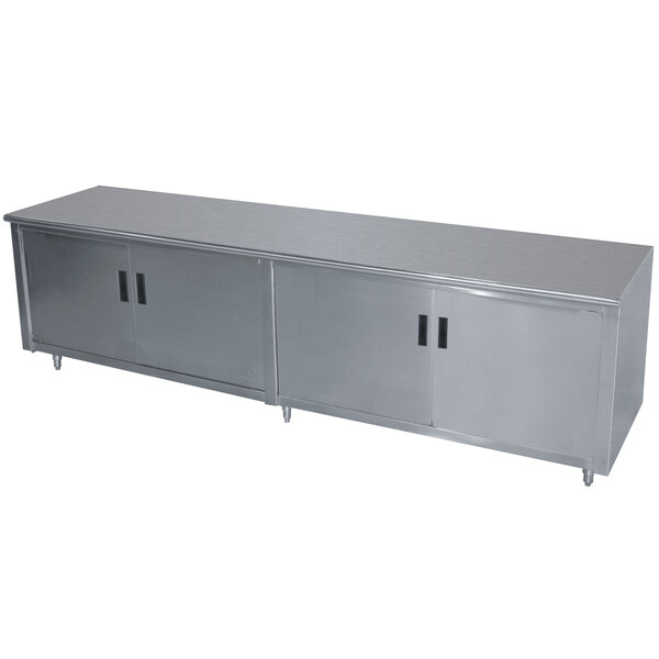 A long stainless steel enclosed base cabinet with hinged doors.