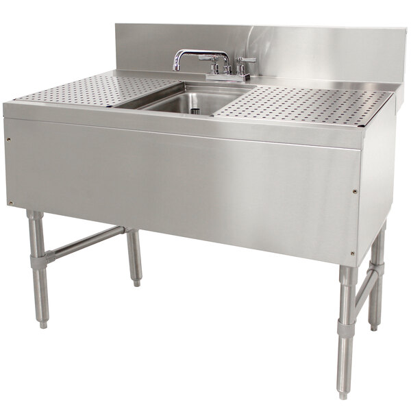 A stainless steel Advance Tabco underbar sink with a deck mount faucet.