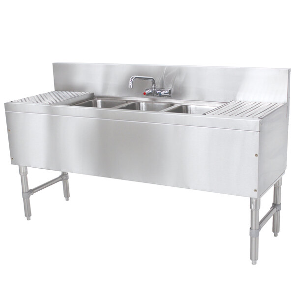 A stainless steel Advance Tabco prestige series underbar sink with 3 compartments, 2 drainboards, and a splash mount faucet.
