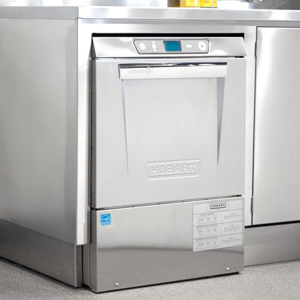 A stainless steel Hobart LXeR-1 undercounter dishwasher with a blue screen.