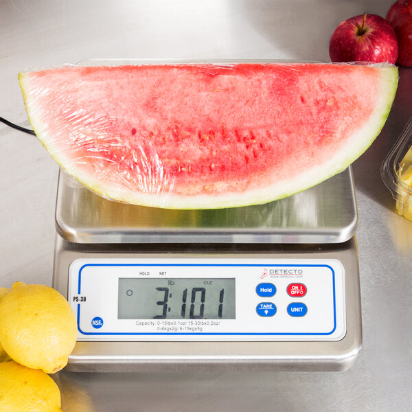 A watermelon on a Cardinal Detecto digital portion scale.