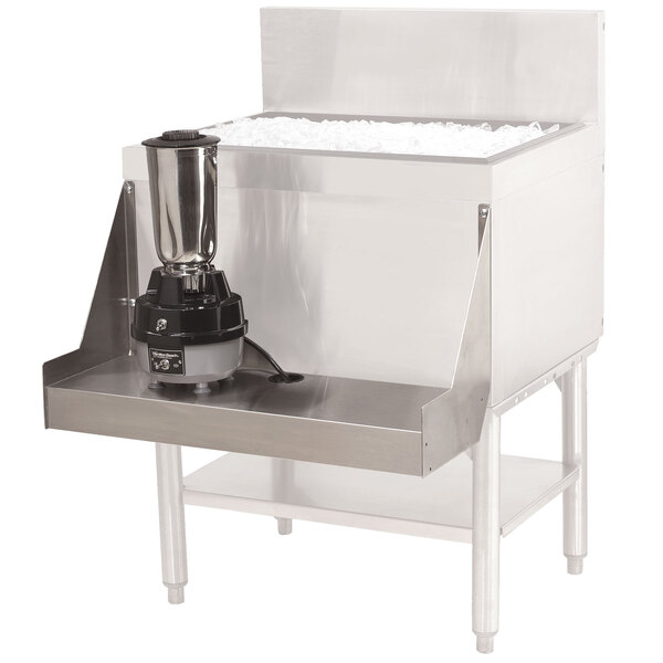 A stainless steel Advance Tabco blender shelf with a blender on it.