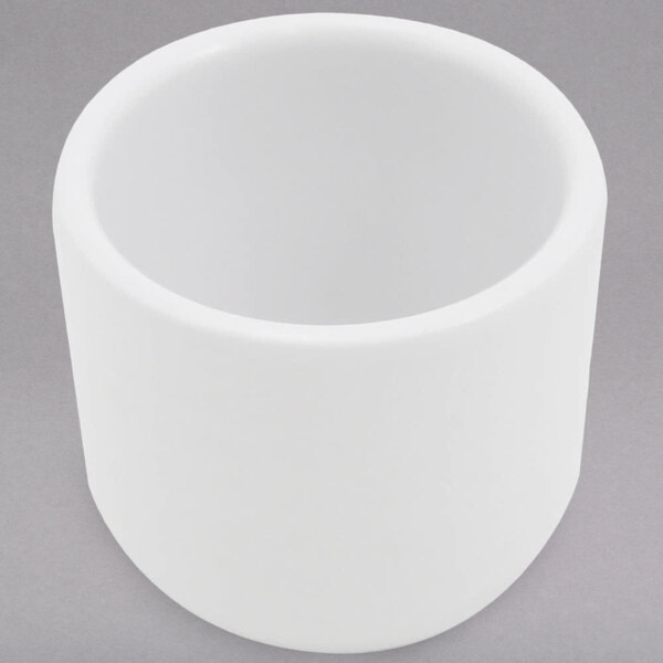 A white cylinder shaped Elite Global Solutions melamine sauce cup.