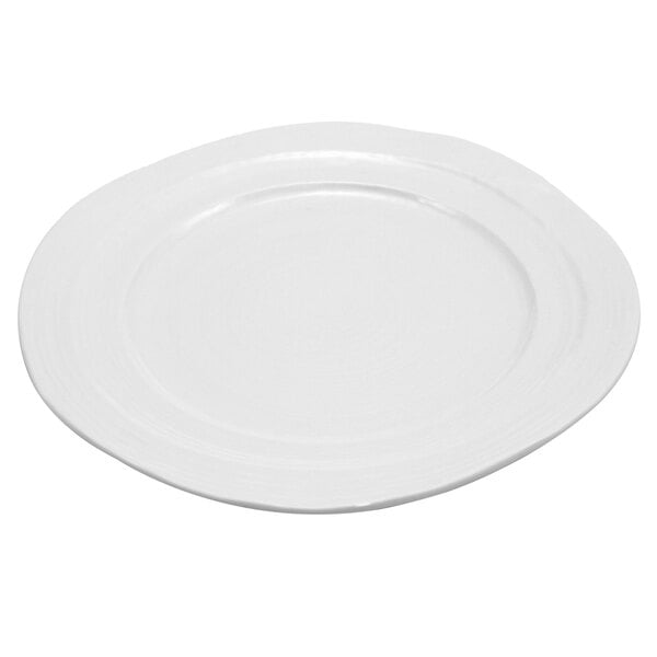 An Elite Global Solutions Della Terra white melamine plate with a curved edge.