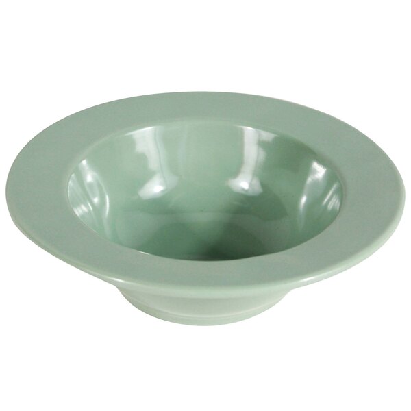 A green Elite Global Solutions melamine bowl with a white rim.