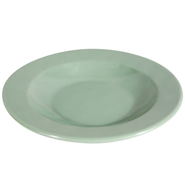 A green Elite Global Solutions Cottage Vintage Hemlock melamine bowl with a white round rim.