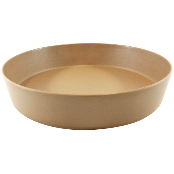 A brown bowl on a white surface.