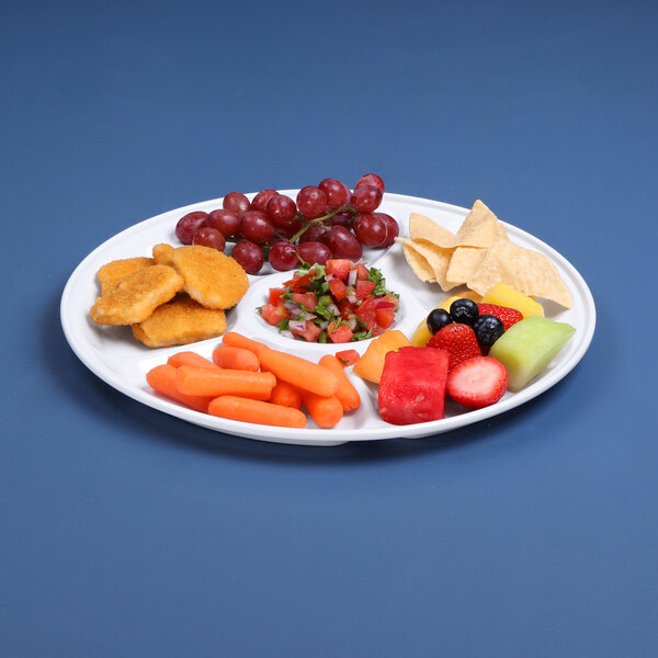 A white melamine tray with 6 compartments holding fruit and vegetables.