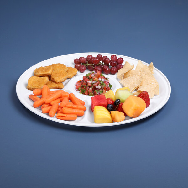 A white Elite Global Solutions Merced tray with compartments holding fruit and vegetables.