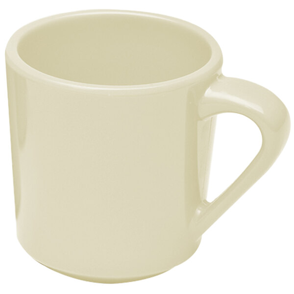 A close-up of a white coffee mug with a handle.