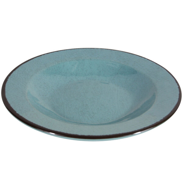 A blue melamine bowl with a black rim.
