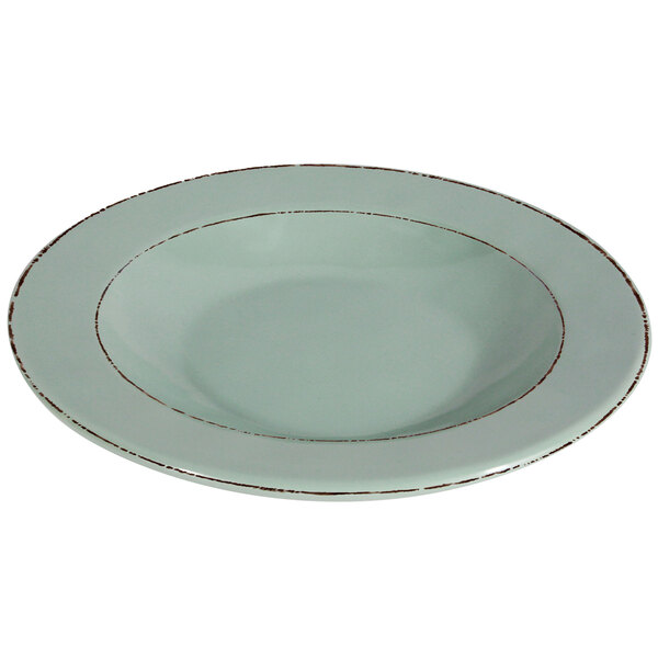 A small green melamine bowl with a white rim.