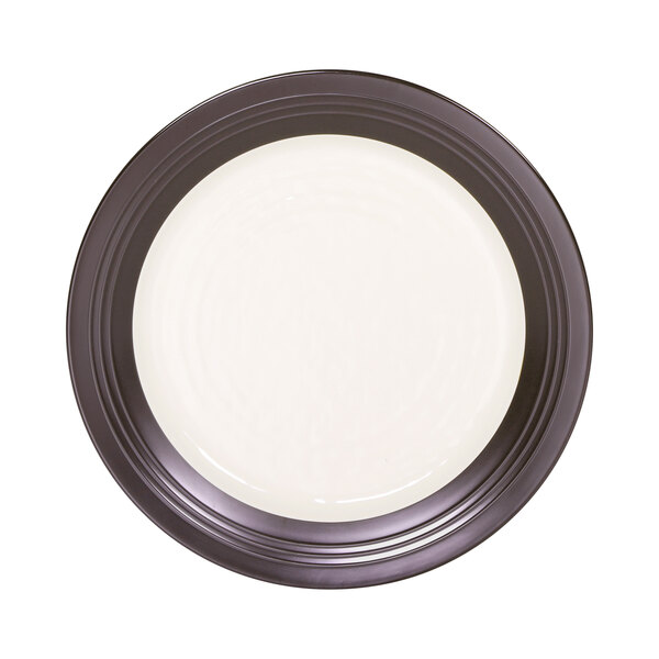 An Elite Global Solutions Durango two-tone melamine plate in white with a chocolate rim.