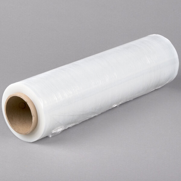A roll of Lavex clear plastic hand pallet wrap on a gray surface.
