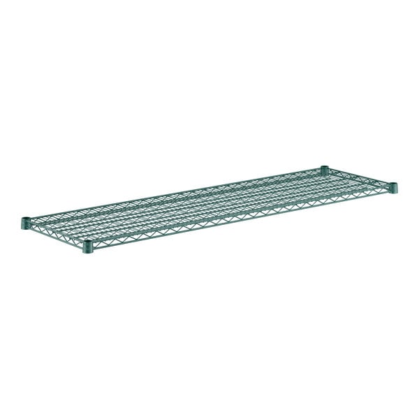 A close-up of a green metal shelf with holes.