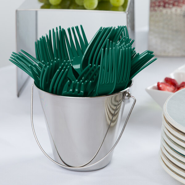 A bucket of green forks.
