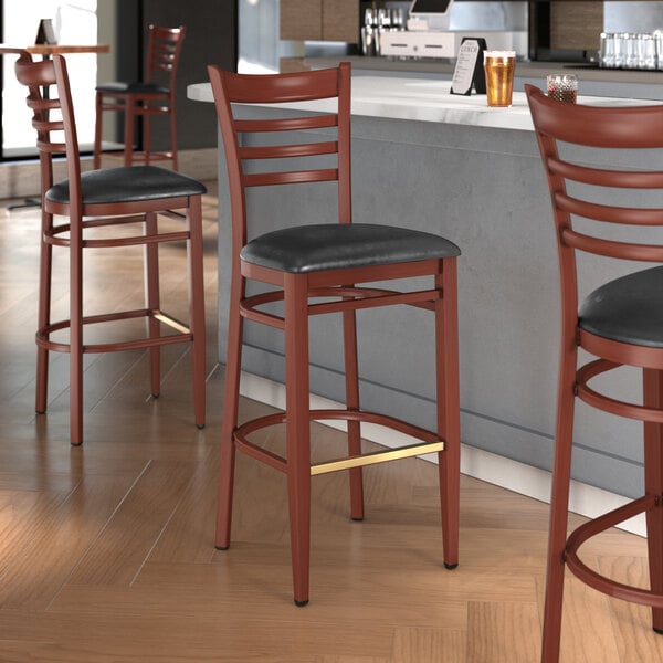 Lancaster Table & Seating Spartan Series Metal Ladder Back Bar Stool with Mahogany Wood Grain Finish and Black Vinyl Seat