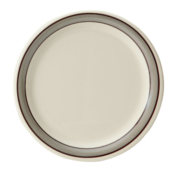A white plate with a brown rim.