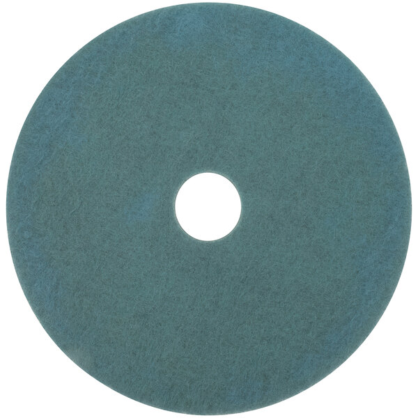 A blue circular 3M Aqua burnishing floor pad with a white circle in the middle.