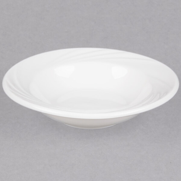A CAC white porcelain fruit dish with a wavy design.
