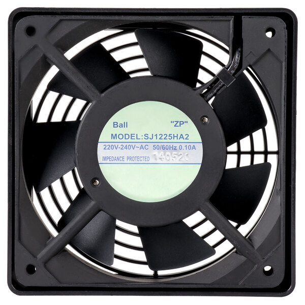 A close-up of a black fan with a white label.