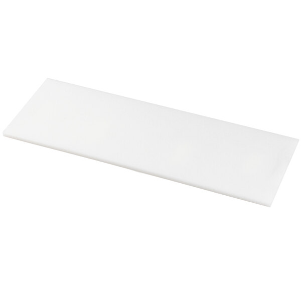 A white rectangular cutting board with a black handle.