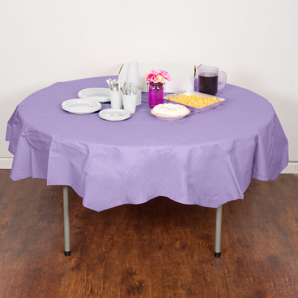 A table with a Luscious Lavender purple Creative Converting tablecloth and plates and cups.