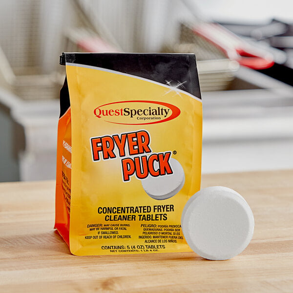 A bag of Fryer Puck deep fat fryer cleaner tablets on a table.