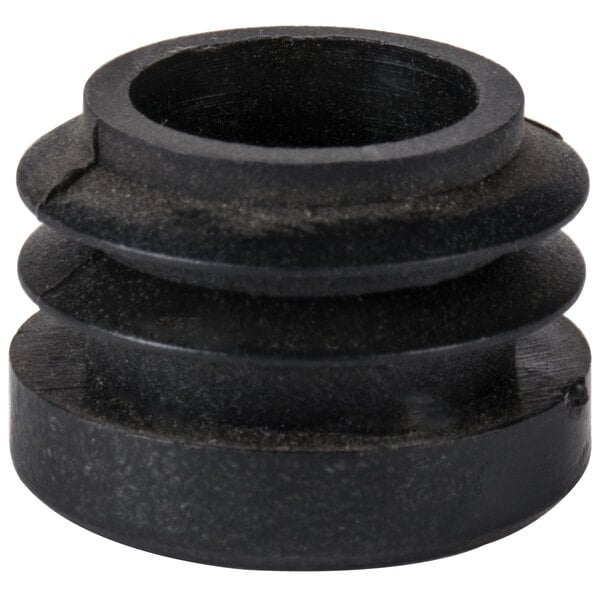 A black round rubber plug with a hole in it.
