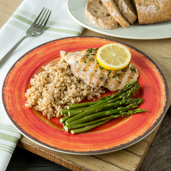A Carlisle Mingle melamine plate with rice, asparagus, and chicken on it.